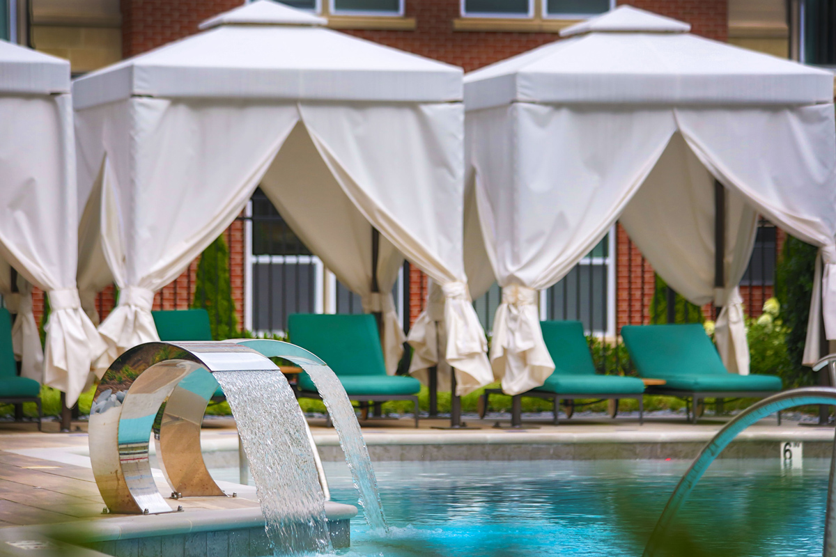 The Remy poolside cabanas and waterfall feature - Lanham, MD