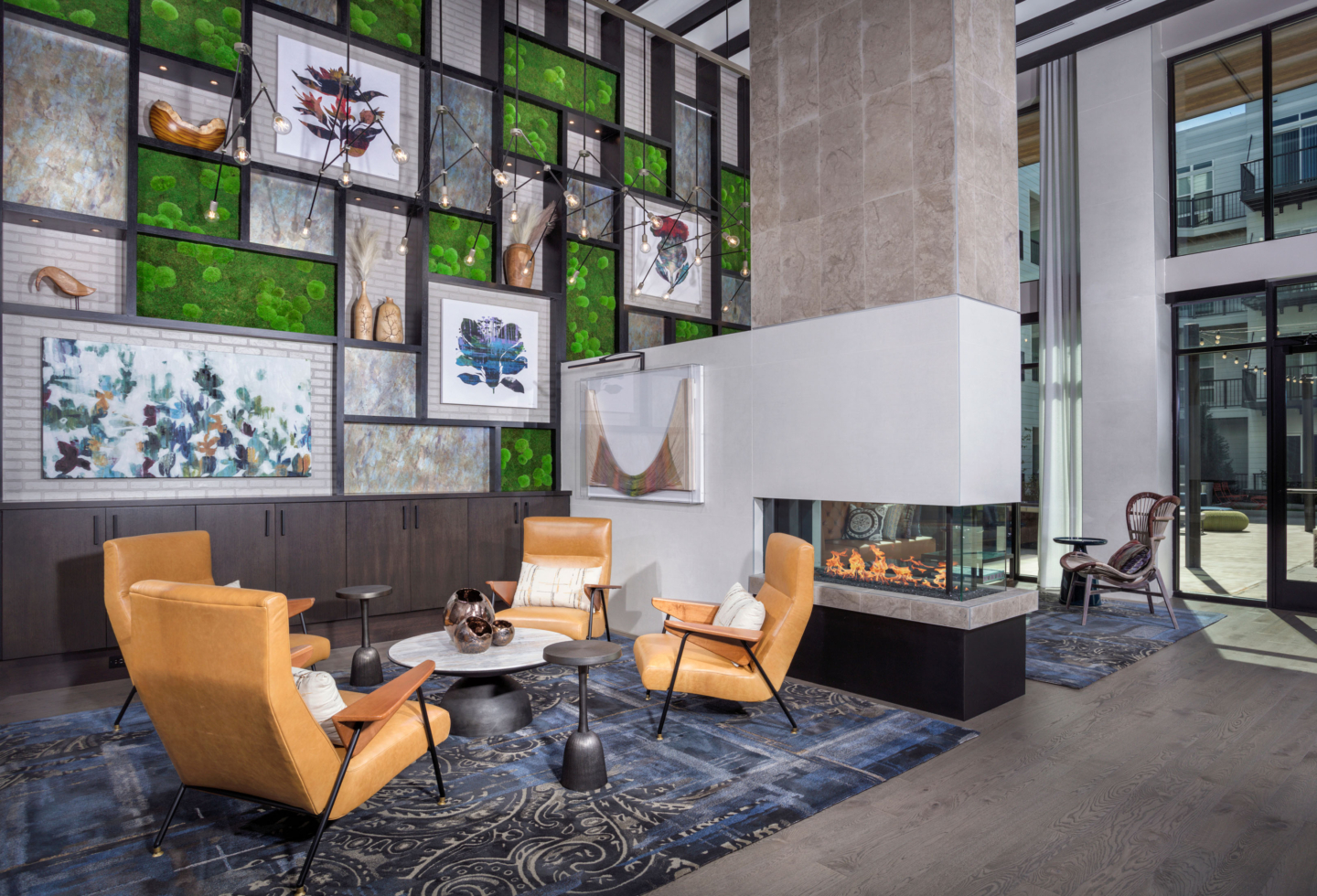 The Remy lobby lounge with fireplace and seating - Lanham, MD