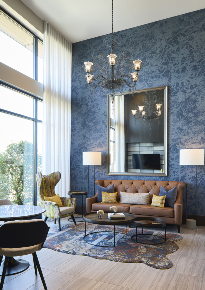 The Remy lounge with sofa and chandelier - Lanham, MD